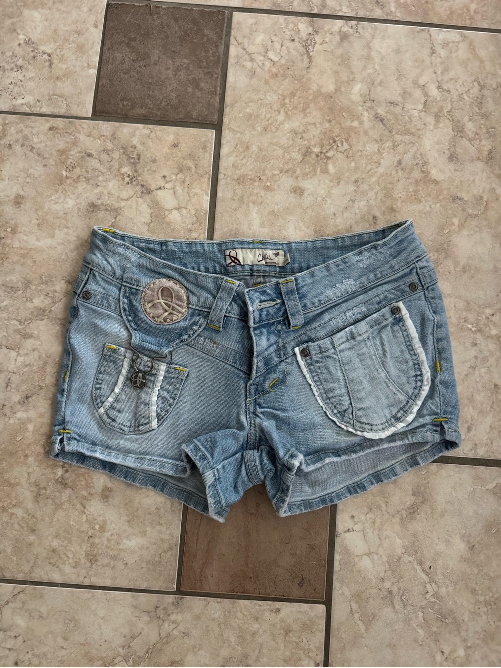 chic Light Blue Denim Shorties with Pocket Embellishments